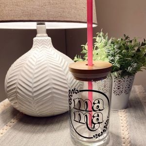 Glass can with bamboo lid and straw